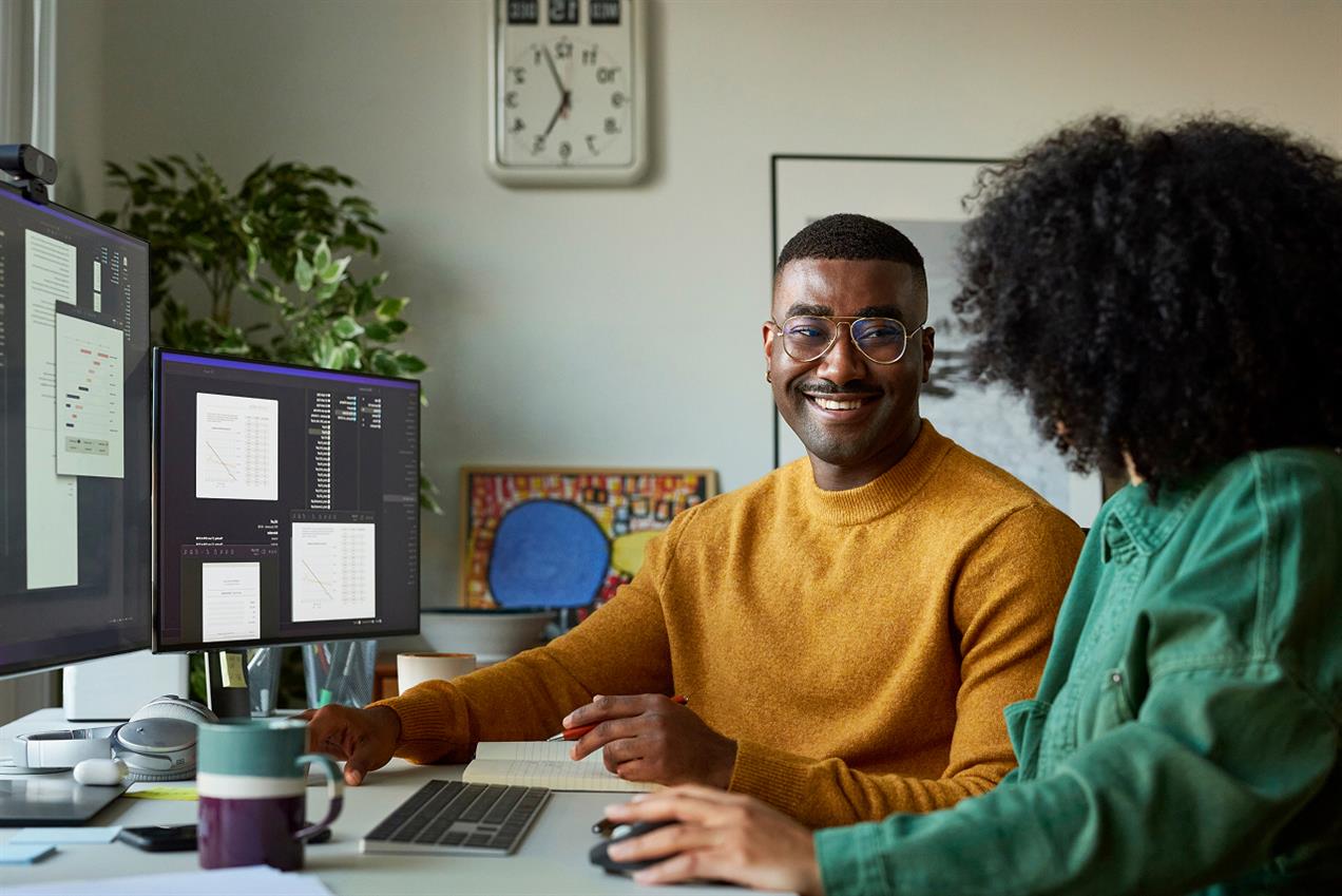 Colleagues working together at desk