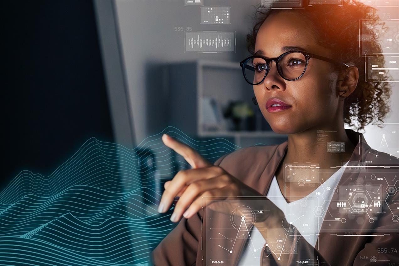 Woman pointing at technology on screen