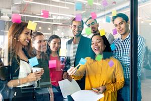 Employees in the office learning with post-it notes