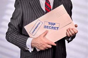 a man in a suit carrying a package with top secret - confidential writing on it