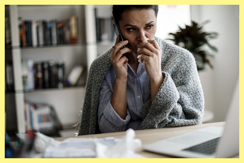 woman looking ill talking on the phone