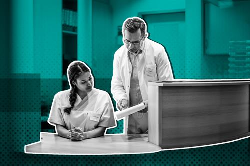 Medical secretary and doctor talking