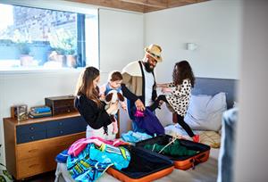 a family of 4 packing for a holiday