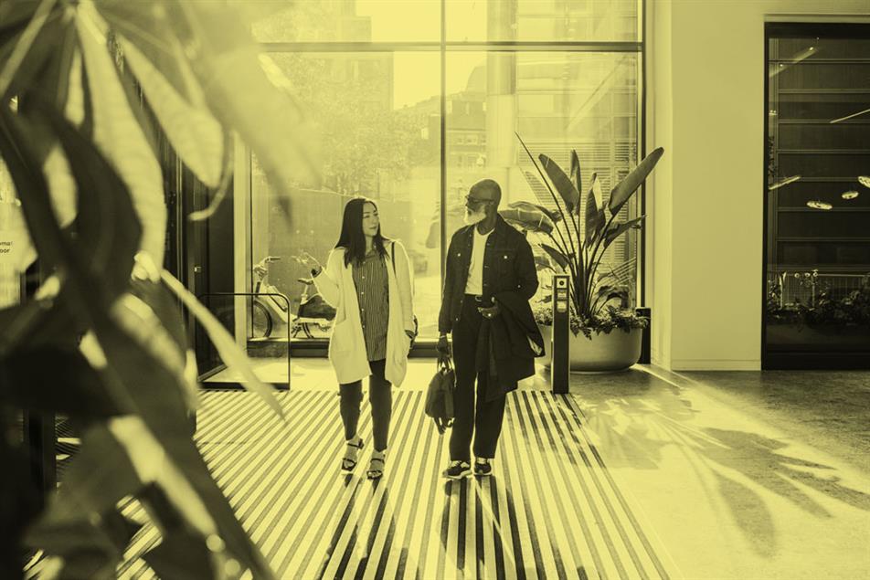 People walking into modern office