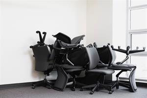 office chairs piled in corner