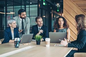Colleagues discussing in office