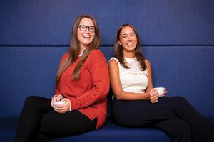 Lydia Hall and Mona Moeil sitting against blue background