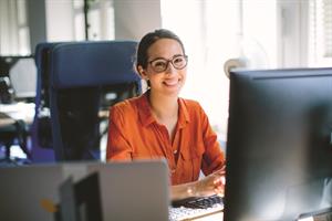 Woman sat in front of laptop