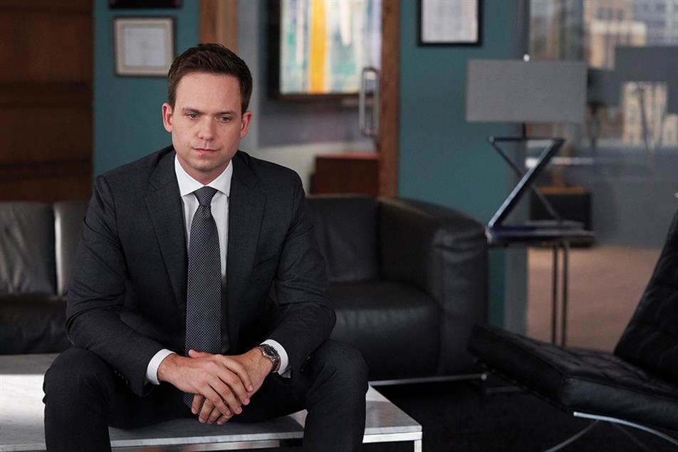 man in a suit in a lawyer's office