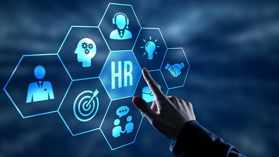 Hand pointing towards a screen with 'HR' and some logos