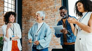 Group of colleagues smiling and laughing together 