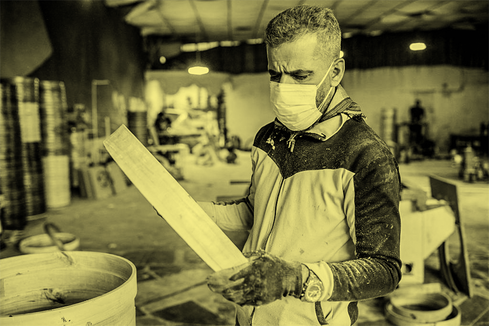 Person working with protective face covering on