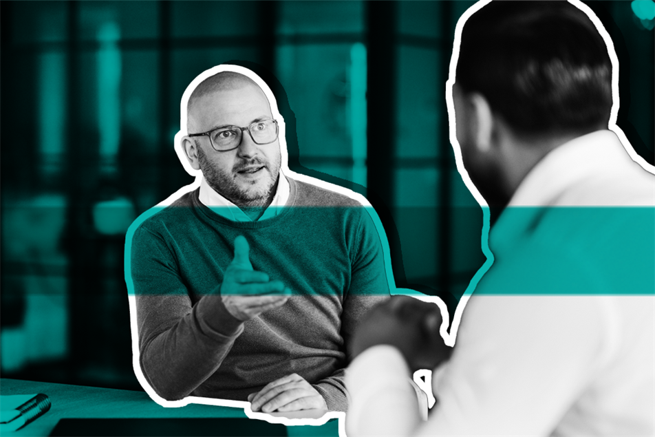 Two people sat down talking