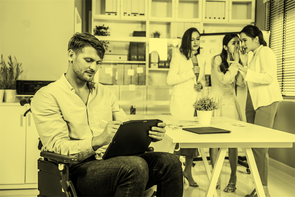 Man in wheelchair in office setting