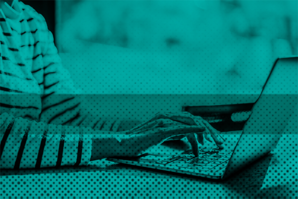 Close up of someone on a laptop