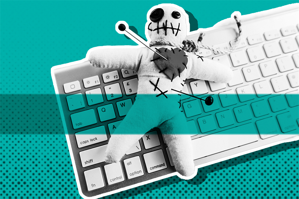 Voodoo doll on a computer keyboard