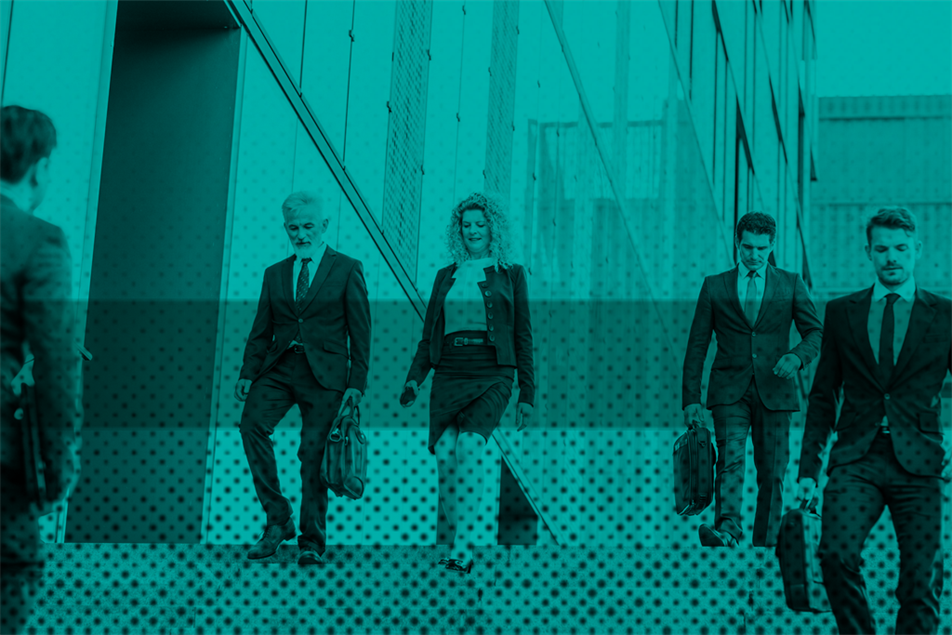 Group of business people walking by an office