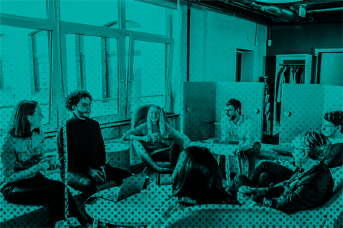 Group of employees talking in the office