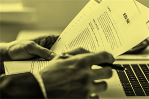 Close up of hands holding a CV