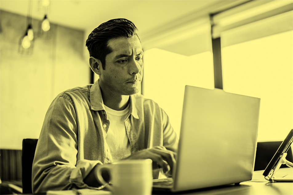 Man sat in front of a laptop