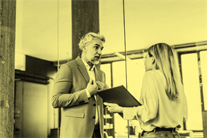 Two people talking in an office