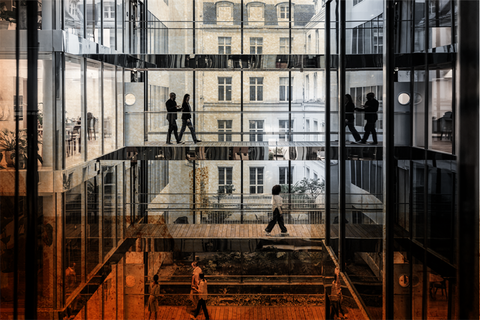 People walking through different floors of an office