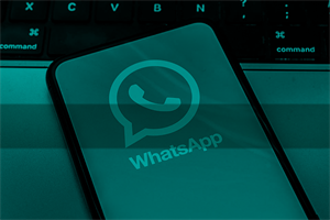 Close up of a phone with WhatsApp symbol on it