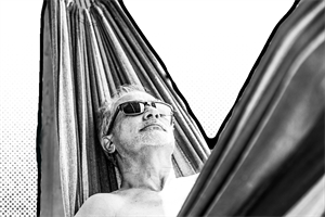 Man lying in a hammock